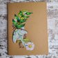 Elemental Elements journal notebook Luna Moth on a crescent moon made of leaves and daisies.