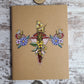 Journal with a uterus that has floral elements on both fallopian tubes and in the center of the uterus.