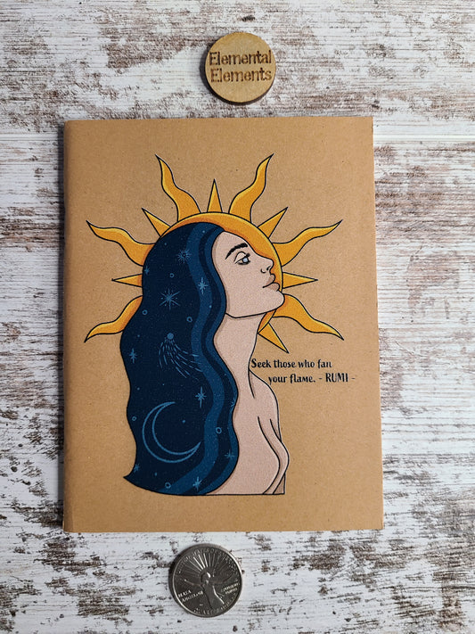 Journal with a human with long blue galaxy hair and a sun in the background with a Rumi quote that says seek those who fan your flame -Rumi.